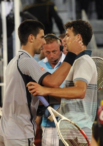 Novak Djokovic (L) congratulates Grigor Dimitrov in Madrid on May 7, 2013