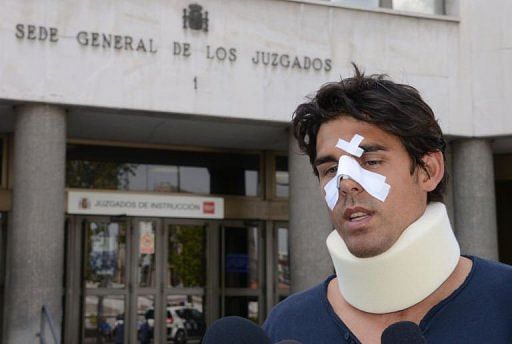 Thomas Drouet of Monaco, training partner of Australian tennis player Bernard Tomic, leaves court in Madrid, May 6, 2013