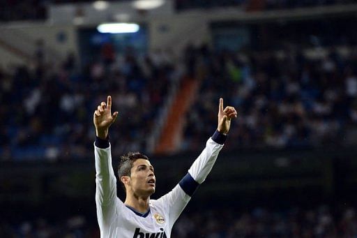 Real Madrid&#039;s Cristiano Ronaldo celebrates after scoring in Madrid on May 8, 2013