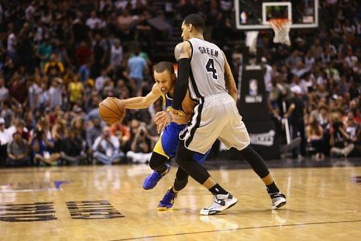 Stephen Curry of the Golden State Warriors dribbles the ball against Danny Green of the San Antonio Spurs on May 8, 2013