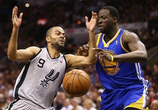 Tony Parker (L) and Draymond Green in Game Two of the Western Conference Semifinals on May 8, 2013 in San Antonio