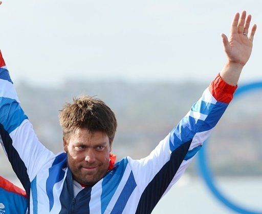 Andrew Simpson celebrates on the podium at the London 2012 Olympic Games, on August 5, 2012