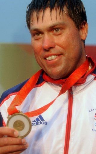 File picture from August, 2008 shows British Olympian Andrew Simpson showing his  gold medal at the 2008 Beijing Games