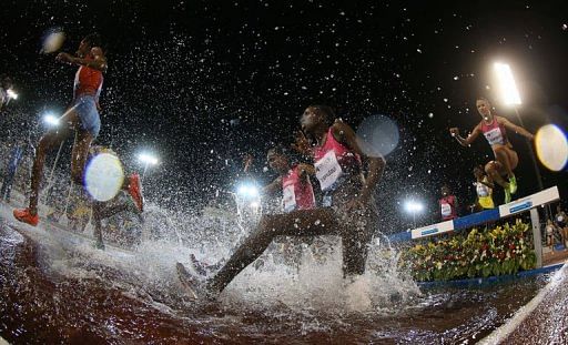 Athletes compete in the women&#039;s 3000m steeplechase in Doha on May 10, 2013