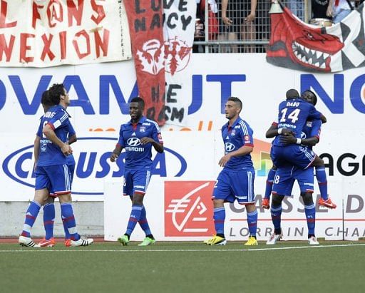 Lyon&#039;s players celebrate after scoring a goal in the match against Nancy, May 5, 2013 in Tomblaine