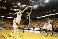 Tony Parker of the San Antonio Spurs shoots against Andrew Bogut of the Golden State Warriors on May 10, 2013