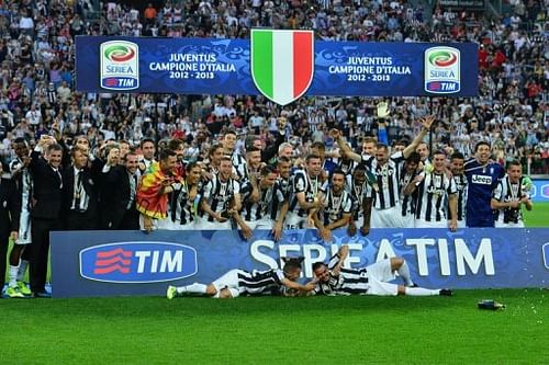 Juventus players celebrate with the Scudetto during a ceremony at the 