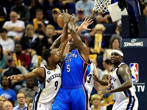 Kendrick Perkins #5 of the Oklahoma City Thunder battles Tony Allen of the Memphis Grizzlies, May 11, 2013 in Memphis