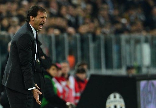 AC Milan coach Massimiliano Allegri shouts instructions during a Serie A  match against Juventus on April 21, 2013