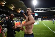 Zlatan Ibrahimovic is about to throw his shirt to fans as he celebrates on May 12, 2013
