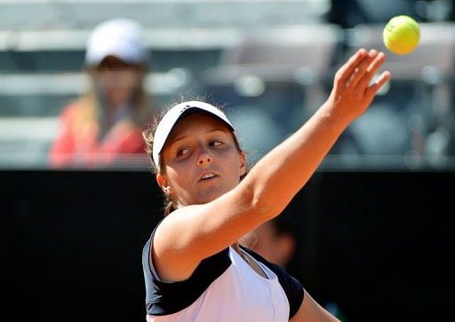 Laura Robson serves to Venus Williams during their WTA Italian Open game in Rome on May 13, 2013