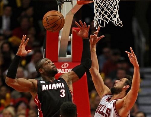 Dwyane Wade of the Miami Heat and Chicago Bulls' Marco Belinelli during their game at the United Center on May 13, 2013