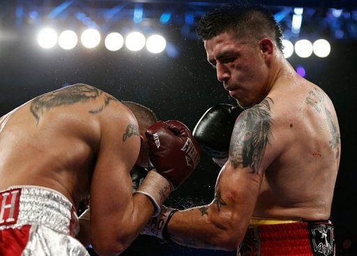 Brandon Rios (R) lands a left uppercut on Mike Alvarado during fight in Las Vegas on March 30, 2013