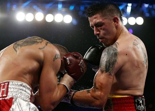 Brandon Rios (R) lands a left uppercut on Mike Alvarado during fight in Las Vegas on March 30, 2013