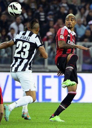 Kevin-Prince Boateng (right) takes on Juventus&#039; Arturo Vidal in Turin on April 21, 2013