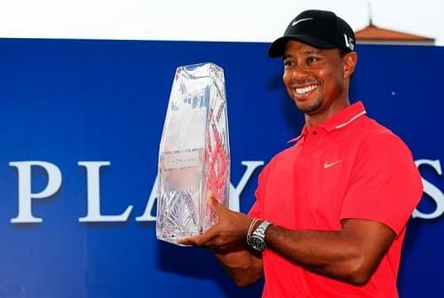 Tiger Woods holds the winner's trophy at TPC Sawgrass on May 12, 2013 in Ponte Vedra Beach