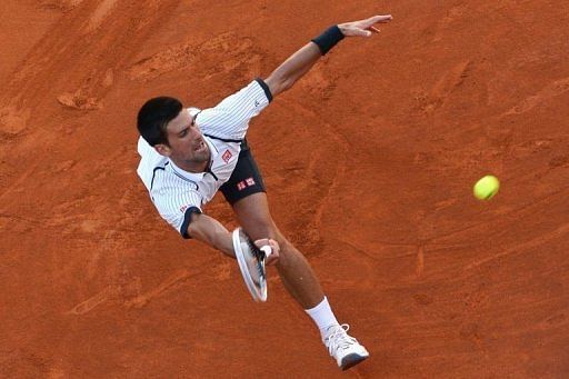 Novak Djokovic returns the ball to Albert Montanes in Rome on May 14, 2013