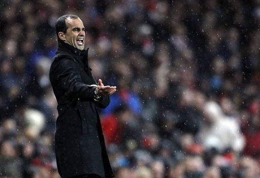 Wigan manager Roberto Martinez shouts from the sidelines during the Premier League match against Arsenal on May 14, 2013
