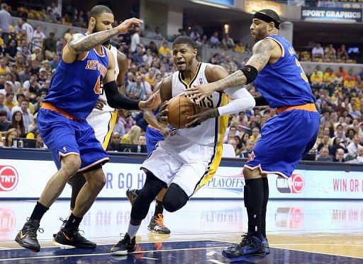 New York Knicks&#039; Tyson Chandler (L) and Kenyon Martin try to block Paul George (C) of the Indiana Pacers on May 14, 2013