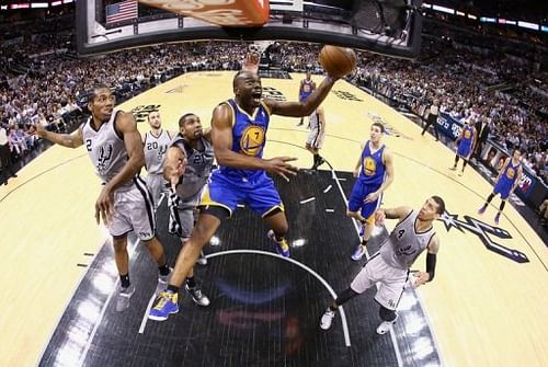 Golden State Warriors' Carl Landry (C) takes a shot during their game against the San Antonio Spurs on May 14, 2013