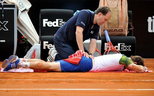 Andy Murray receives treatment during his match against Marcel Granollers in the Rome Masters on May 15, 2013