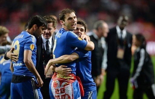 Branislav Ivanovic (L) celebrates with teammate Oscar after Chelsea won the Europa League final on May 15, 2013
