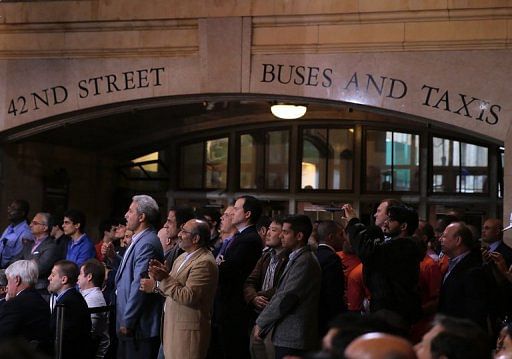 Fans watch as wrestlers from the USA and Iran battle during the Rumble on the Rails Wrestling, May 15, 2013 in New York