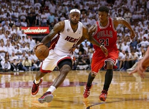 Miami Heat's LeBron James is guarded by Chicago Bulls' Jimmy Butler during their game in Miami on May 15, 2013