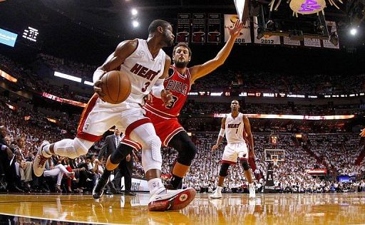Dwyane Wade of the Miami Heat and Chicago Bulls&#039; Marco Belinelli are pictured during their game in Miami on May 15, 2013