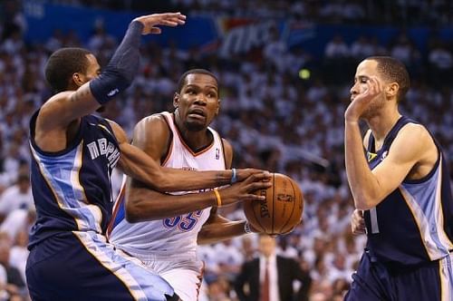 Oklahoma City's Kevin Durant (C) and the Memphis Grizzlies' Mike Conley are pictured during their game on May 15, 2013