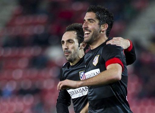 Atletico Madrid&#039;s Juanfran and Raul Garcia (R) are pictured during their match against Mallorca on January 6, 2013