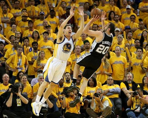 Manu Ginobli of the San Antonio Spurs shoots over Klay Thompson of the Golden State Warriors on May 16, 2013