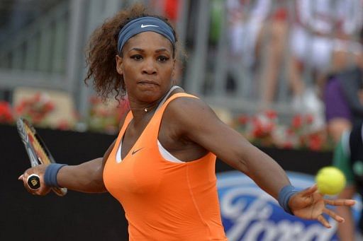 Serena Williams returns a ball to Slovakia&#039;s Dominika Cibulkova at the Rome Masters  on May 16, 2013