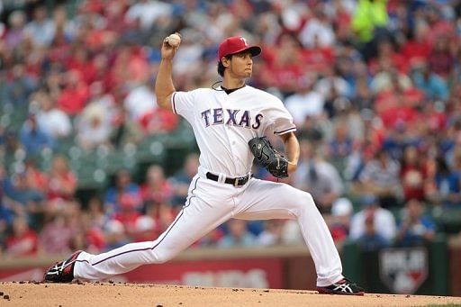 Yu Darvish of the Texas Rangers throws in the first inning against the Detroit Tigers, May 16, 2013 in Arlington, Texas