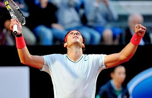 Spain's Rafael Nadal celebrates after beating Spain's David Ferrer on May 17, 2013 in Rome