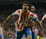 Atletico Madrid's forward Diego Costa (L) celebrates with his teammate Arda Turan after scoring on May 17, 2013
