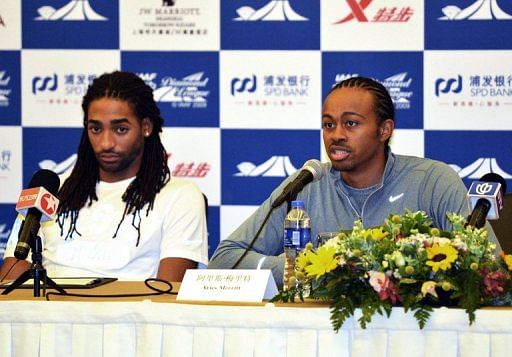 Aries Merritt of the US (R) and compatriot Jason Richardson (L) attend a  press conference in Shanghai on May 17, 2013