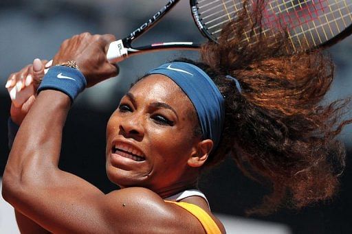 Serena Williams returns the ball to Romania&#039;s Simona Halep during their semi-final on May 18, 2013 at the Rome Masters