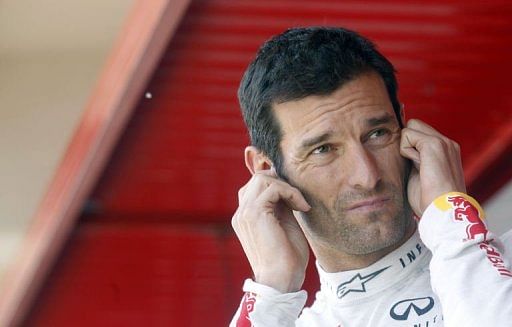 Red Bull&#039;s Mark Webber stands in the pits ahead of the Spanish Formula One Grand Prix near Barcelona on May 11, 2013