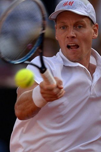 Czech Republic&#039;s Tomas Berdych returns a ball to Spain&#039;s Rafael Nadal on May 18, 2013 in Rome