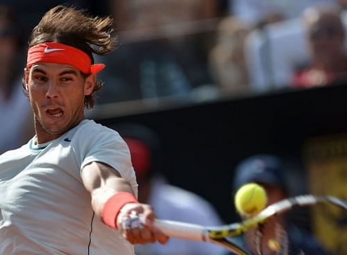 Spain's Rafael Nadal returns a ball to Czech Republic's Tomas Berdych on May 18, 2013 in Rome