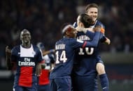 Paris Saint-Germain's Zlatan Ibrahimovic (C) celebrates with Blaise Matuidi (L) and David Beckham, May 18, 2013 in Paris