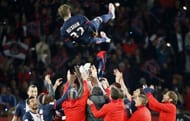 Paris Saint-Germain's midfielder David Beckham (C) is thrown into the air on May 18, 2013 at Parc des Princes stadium