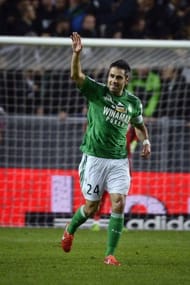 Saint-Etienne's midfielder Loic Perrin waves after scoring a goal on May 18, 2013 in Saint-Etienne, central France