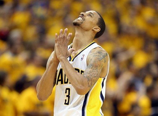 George Hill of the Indiana Pacers celebrates in the game against the New York Knicks on May 18, 2013 in Indianapolis