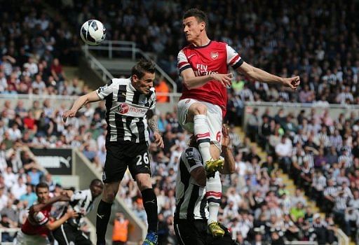 Arsenal&#039;s Laurent Koscielny attempts a header on goal in Newcastle Upon Tyne on May 19, 2013