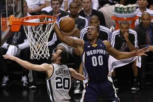 Darrell Arthur of the Grizzlies tries to control a rebound against Manu Ginobili of the San Antonio Spurs, May 19, 2013