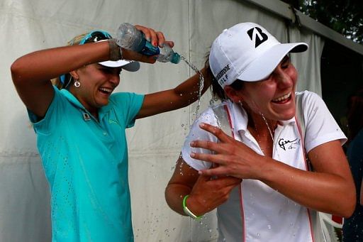 Lexi Thompson dunks water on Jennifer Johnson following her first LPGA victory, in Mobile, Alabama, on May 19, 2013