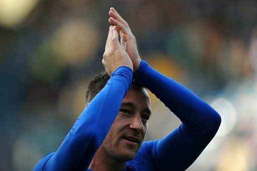Chelsea defender John Terry greets the crowd at the end of their Premier League match against Everton on May 19, 2013