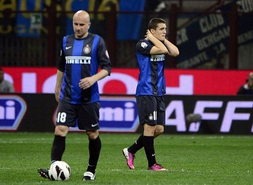 Inter Milan midfielder Mateo Kovacic (R) reacts during their Serie A match against Roma on April 17, 2013